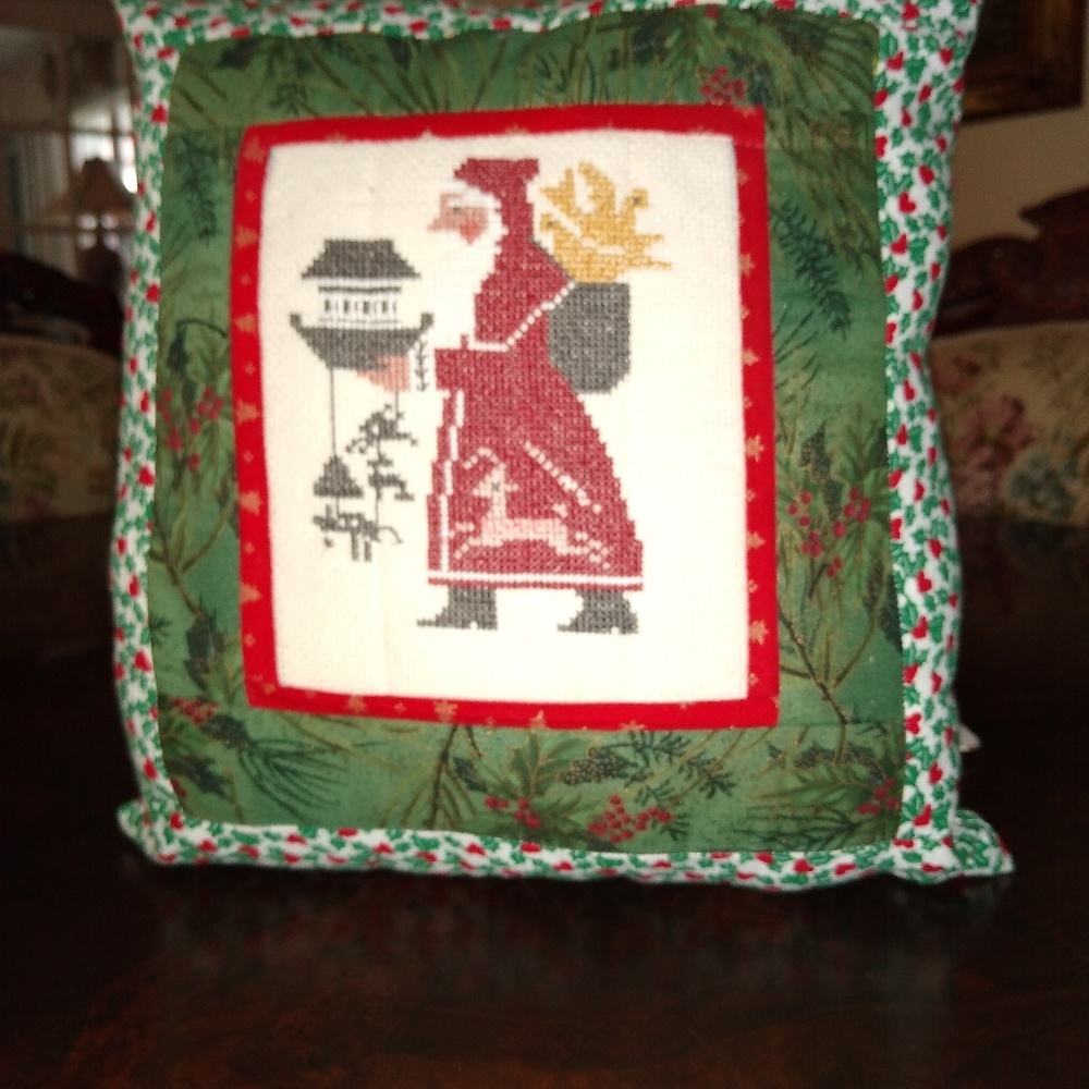 Santa Claus with gift cushion